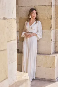 Top en gasa blanca con plumas bordadas con manga ablusonada
