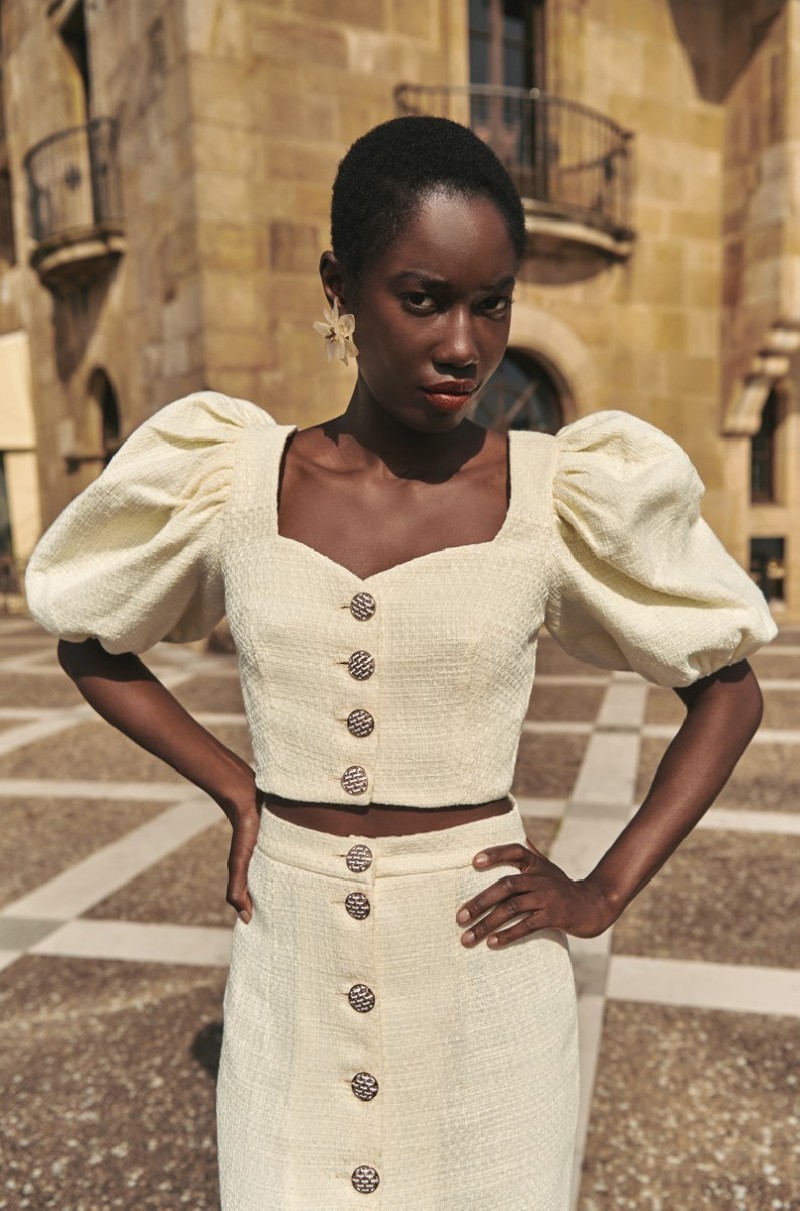 Top manga abullonada joya chanel blanco roto