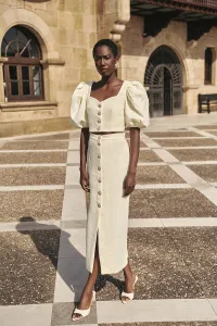 Top manga abullonada joya chanel blanco roto