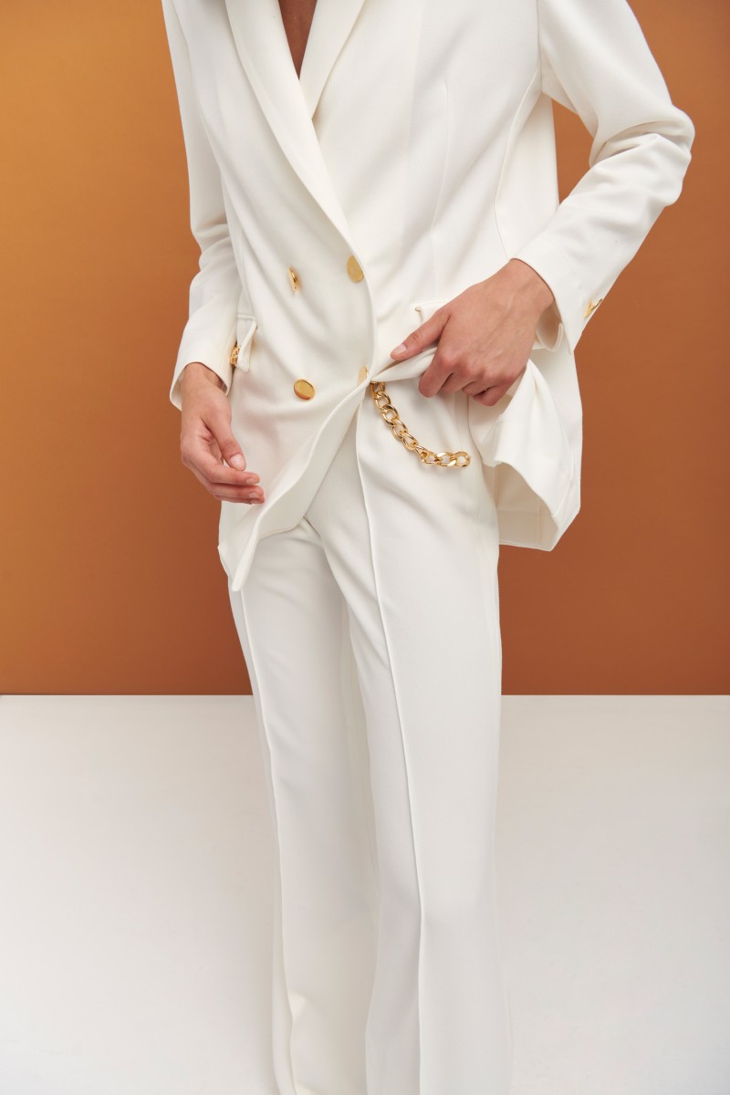 Pantalón palazzo blanco con cadena